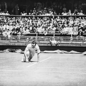 Fred Perry falls yet smiles on the court at The Wimbledon Mens Tennis Championships 1935 Fred Perry falls yet smiles on the court at The Wimbledon Mens Tennis Championships 1935