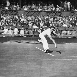 Fred Perry plays a back hand pass on The Centre Court at The Mens Wimbledon Tennis Fred Perry plays a back hand pass on The Centre Court at The Mens Wimbledon Tennis