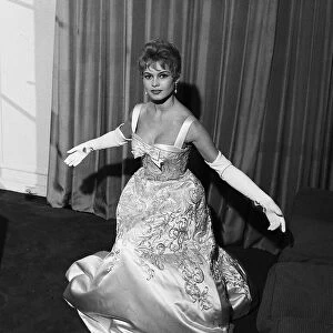 French actress Bridgitte Bardot rehearses her curtsy in anticipation of her meeting with