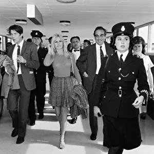 French actress Brigitte Bardot arrives at London airport as she visits England to film
