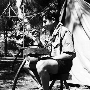 A French Boy scout attending the Scouts World Jamboree which is in Moisson near Paris