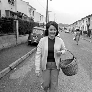 French housewife Mrs. Maria Quaranta with her food basket