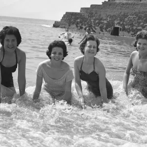 Friends enjoying so early summer sunshine on the south coast during the Whitsun Bank