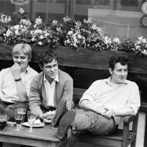 Three friends enjoying a joke and a drink in London. 2nd August 1968 Three friends enjoying a joke and a drink in London. 2nd August 1968