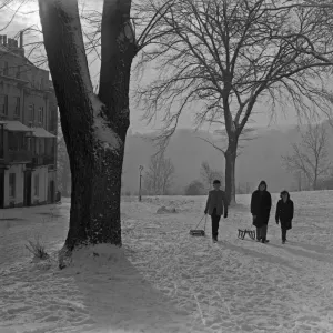 Print of Friends pulling sledges up Sion Hill, Clifton, Bristol Print of Friends pulling sledges up Sion Hill, Clifton, Bristol