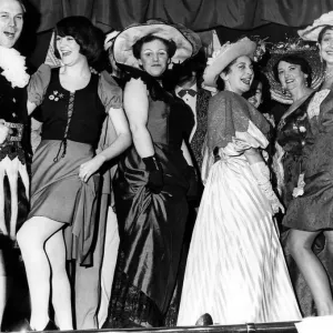 Frills, flounces and hint of knobbly knee in an old style music hall show Frills, flounces and hint of knobbly knee in an old style music hall show