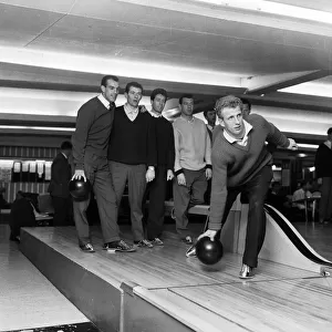 Fulham footballer Alan Mullery with teammates enjoying some recreational time bowling at