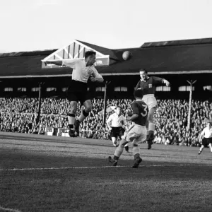 Fulham v. Leicester. Charlie Mitten of Fulham heads the ball. 3rd September 1952