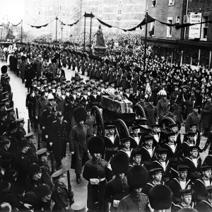 Funeral ceremony of King George V in London showing crowds lined on the streets as
