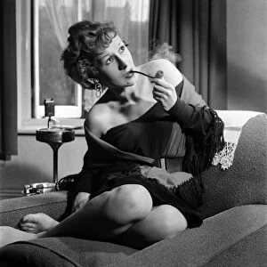 Gaby Silraire seen here smoking a pipe. April 1953 D2098