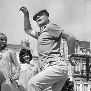 GENE KELLY PERFORMS ON THE SET OF "THE YOUNG GIRLS OF ROCHEFORT"