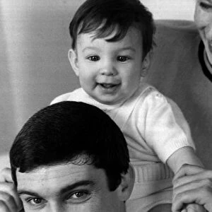 Gene Pitney holding his seven month old son, Tom March 1968