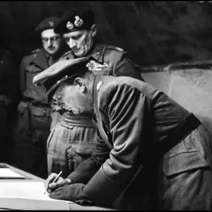 A black and white photograph print of General Kinzel signing the surrender document A black and white photograph print of General Kinzel signing the surrender document