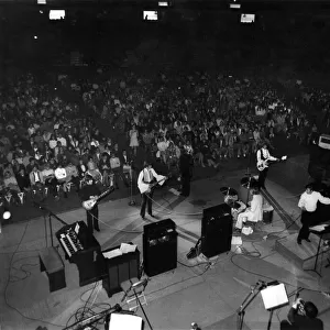 A general scene showing the Bee Gees during their performance at the Anaheim Convention