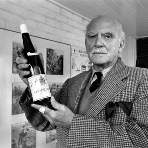 Print of General Sir Guy Salisbury Jones holding a bottle of Hambledon wine