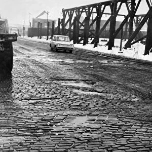 General view along the Bootle section of the Dock Road in Liverpool showing the holes