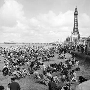 General view showing busy scenes at Blackpool beach in the summer holidays