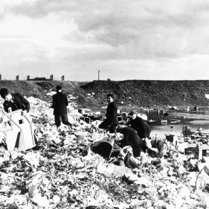 General view of unemployed workers from Cardiff picking over a rubbish tip in 1938