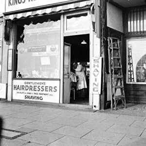 Gentlemens hairdressers in the Kings Road, Brighton, East Sussex. November 1953