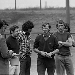 George Best behind Alex Stepney at training ground July 1972 as they watch Pat