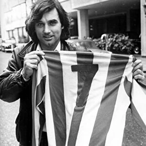 George Best gets the feel of the No. 7 Nuneaton Borough shirt