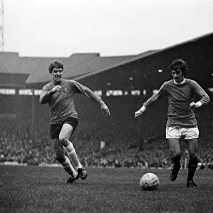 George Best of Manchester United on the ball watched by an Ipswich Town defender during