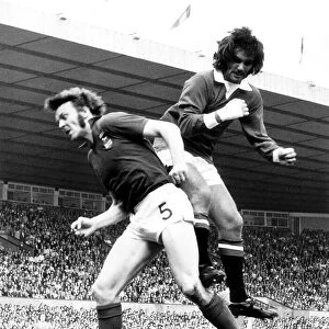 George Best of Manchester United jumps for the ball Aug 1972 against Alan Hunter of