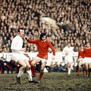 George Best of Manchester United seen here in action against Paul Reaney of Leeds circa