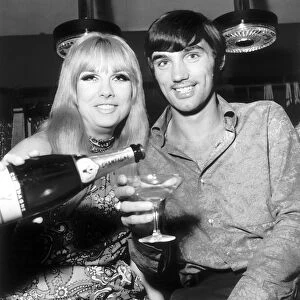 George Best open his boutique in Manchester. The girl topping up George