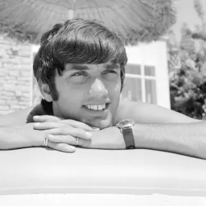 George Best relaxing on an inflatable bed whilst on holiday April 1967