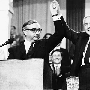 George Brown MP with Harold Wilson arms raised in air following Brown