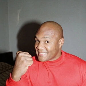 George Foreman pictured in a hotel room. 22nd September 1990