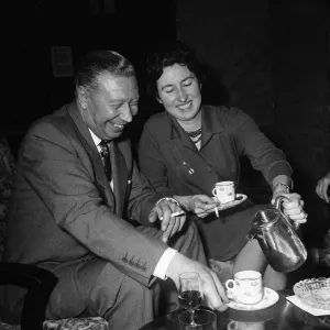 George Formby and fiancee Pat Howsen of Preston. She is wearing the huge solitaire George Formby and fiancee Pat Howsen of Preston. She is wearing the huge solitaire