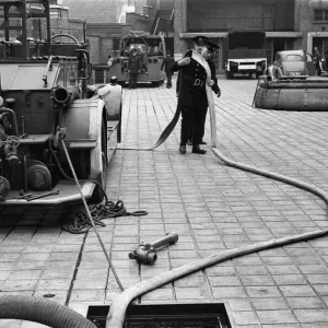 George Greenwell carrying hose with Station Officer Harding seen here during pump George Greenwell carrying hose with Station Officer Harding seen here during pump
