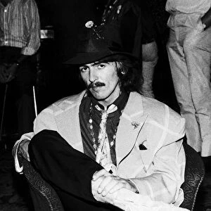 George Harrison of the Beatles sitting in a chair in the Atlantic Hotel in Newquay where