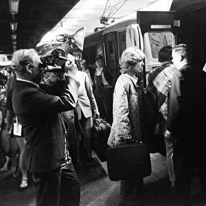 George Harrison boarding the train for Bangor with the Maharishi Yogi on 25 August 1967