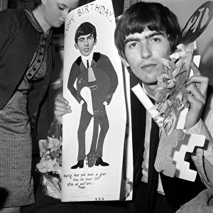 George Harrison, celebrating his 21st birthday. 25 February 1964
