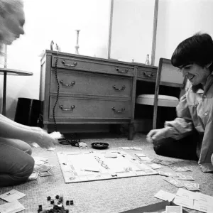 George Harrison and Jackie DeShannon Play Monopoly Print