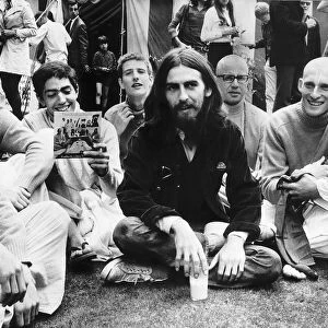 George Harrison with members of the 12 strong Radha Krishna Temple at a press reception