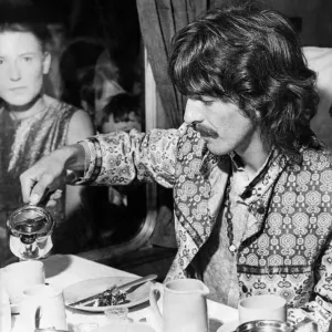 Print of George Harrison in a carriage, pouring tea