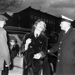 George Harrison and wife Patti Boyd arrive at the memorial service for Beatles manager