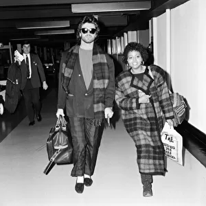 George Michael of the pop group Wham!, and girlfriend Pat Fernandez leaving Heathrow for