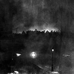 The German airship SL-11 caught in the beams of a searchlight shortly before it was shot