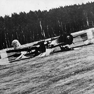 A German bomber on a Brandenburg airfield being strafed by Captain Nicolas Magura in his