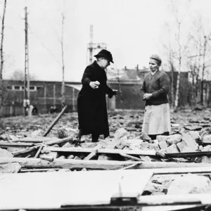 A German civilian views wreckage of her home that was destroyed by a German artillery A German civilian views wreckage of her home that was destroyed by a German artillery