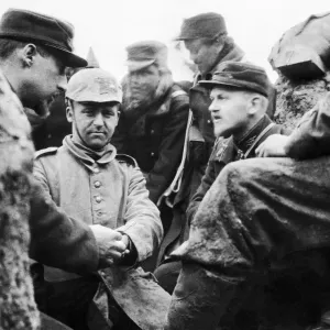 A German soldier captured by the Belgian troops is given medical treatment to an injured A German soldier captured by the Belgian troops is given medical treatment to an injured