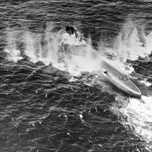 A German U-boat caught in a hail of gunfire and bombs dropped by a Sunderland flying boat