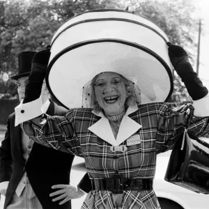 Gertrude Shilling at Royal Ascot, wearing a large straw hat Gertrude Shilling at Royal Ascot, wearing a large straw hat