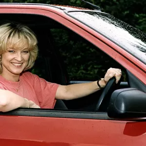 Gillian Taylforth actress Kathy in BBC television soap opera Eastenders in Citroen diesel