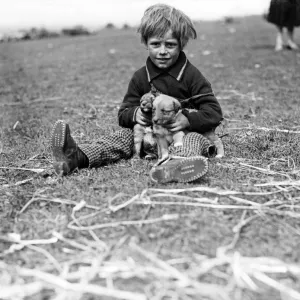 Gipsy child and pet dog at Epsom Downs, Surrey. 1932 Gipsy child and pet dog at Epsom Downs, Surrey. 1932